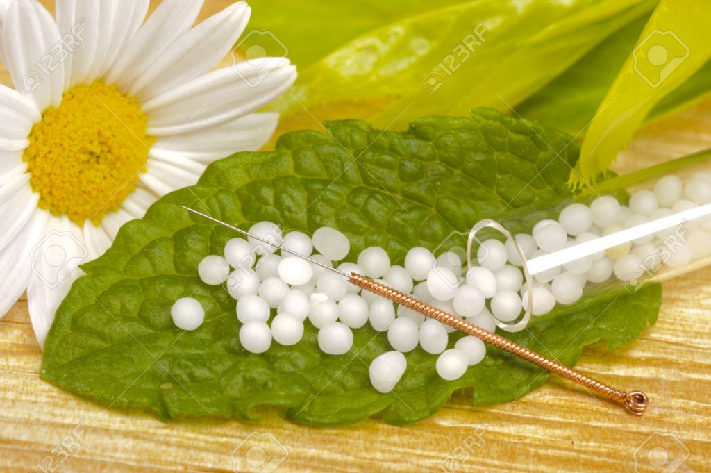 alternative medicine with acupuncture and homeopathy with herbal pills
